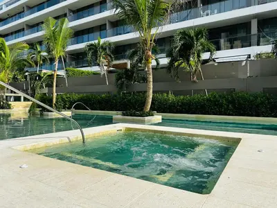 a swimming pool in front of a building at Exclusivo loft - frente al mar in Cartagena de Indias