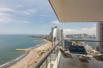 a view of the beach from the balcony of a building at Awesome Sea View and Historic Center “Morros City” in Cartagena de Indias