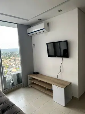 a living room with a flat screen tv on the wall at Luminoso y confortable in Cartagena de Indias