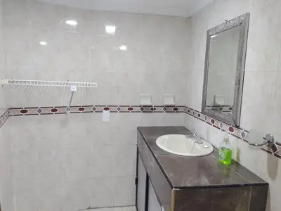a bathroom with a sink and a mirror at Balcón del mar in Cartagena de Indias
