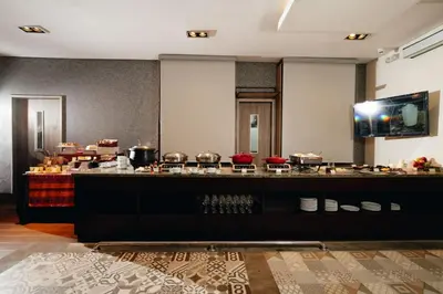 a kitchen with a counter with pots and pans at Wyndham Garden Barranquilla in Barranquilla