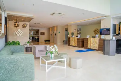 a living room with a couch and a table at Wyndham Garden Barranquilla in Barranquilla