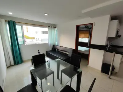 a living room with a glass table and a couch at EM3-1G APARTAMENTO DE 1 HAB EN ZONA RESIDENCIAL AIRE ACONDICIONADO Wifi Y PARQUEADERO in Cartagena de Indias