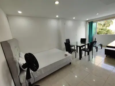 a living room with a couch and a table at EM3-1G APARTAMENTO DE 1 HAB EN ZONA RESIDENCIAL AIRE ACONDICIONADO Wifi Y PARQUEADERO in Cartagena de Indias