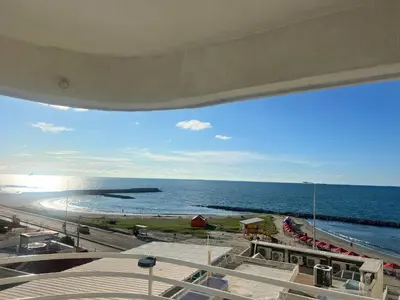 a view of a beach and the ocean from a building at Apartamento con vista al mar Cartagena piscina in Cartagena de Indias