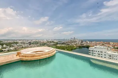 a building with a pool of water on top of it at Stunning Sea View and Historic Center 20th FL/ 2BR in Cartagena de Indias
