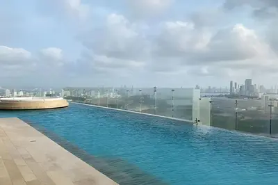 a swimming pool on the roof of a building at Stunning Sea View and Historic Center 20th FL/ 2BR in Cartagena de Indias