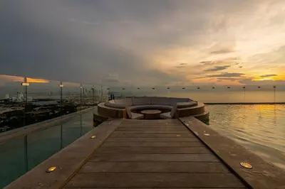 a dock with a bench on top of the water at Espectacular Vista al Mar and Historic Center 2BR in Cartagena de Indias