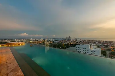 a swimming pool with a city in the background at Espectacular Vista al Mar and Historic Center 2BR in Cartagena de Indias