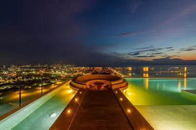 a pool on the top of a building at night at Espectacular Vista al Mar and Historic Center 2BR in Cartagena de Indias