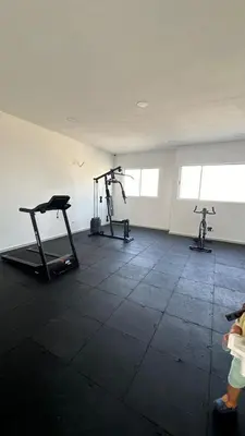 a gym with three exercise bikes in a room at Apartamento amoblado cerca al mar in Cartagena de Indias