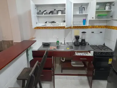 a small kitchen with a sink and a stove at Apartamento Cartagena Torices 50 in Cartagena de Indias