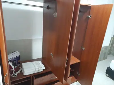 a wooden cupboard with a sink in a room at Apartamento Cartagena Torices 50 in Cartagena de Indias