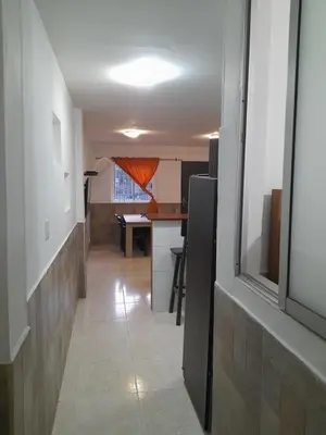 a hallway leading to a kitchen and a dining room at Apartamento Cartagena Torices 50 in Cartagena de Indias