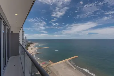 a view of the ocean from the balcony of a building at Exclusive Sea View “Morros City” 30th Fl in Cartagena de Indias