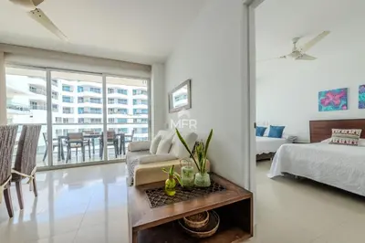 a living room with a couch and a table at Morros Epic - La Boquilla, Seaview & 2Bdr in Cartagena de Indias