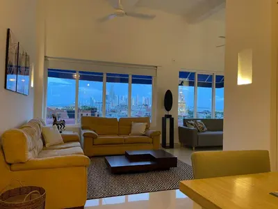 a living room with two couches and a table at HERMOSOS APARTAMENTOS EN La CIUDAD VIEJA in Cartagena de Indias