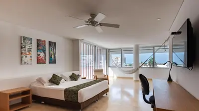 a bedroom with a bed and a ceiling fan at APARTAMENTO GRANDE CARTAGENA La Matuna in Cartagena de Indias