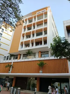 a building with people walking in front of it at APARTAMENTO GRANDE CARTAGENA La Matuna in Cartagena de Indias