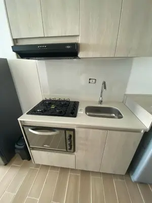 a kitchen with a stove and a sink at Apartamento LOFT INFINITY BLUE in Santa Marta