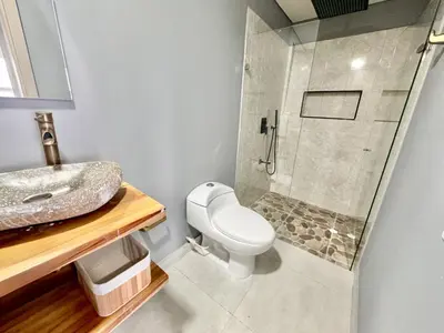 a bathroom with a toilet and a sink and a shower at apto navy 6 tripulantes in Cartagena de Indias