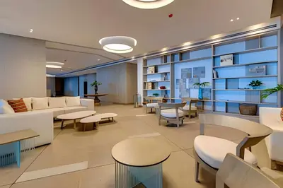 a waiting room at a hospital with tables and chairs at Sea View and Historic Center “Morros City” 2BR in Cartagena de Indias