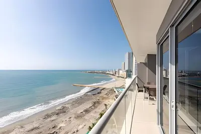 a view of the beach from the balcony of a building at Sea View and Historic Center “Morros City” 2BR in Cartagena de Indias