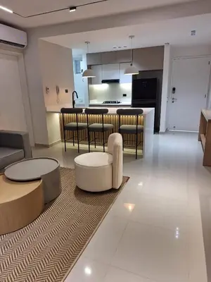 a living room and kitchen with a table and chairs at Lujoso apto con vista al mar en Morros Ultra in Cartagena de Indias