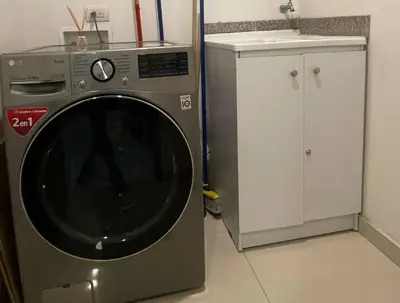 a washing machine in a kitchen with a sink at Exclusive Loft Bluegardens Hilton Inn Apartments Barranquilla in Barranquilla