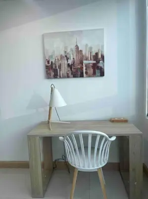a wooden desk with a chair and a lamp at Exclusive Loft Bluegardens Hilton Inn Apartments Barranquilla in Barranquilla