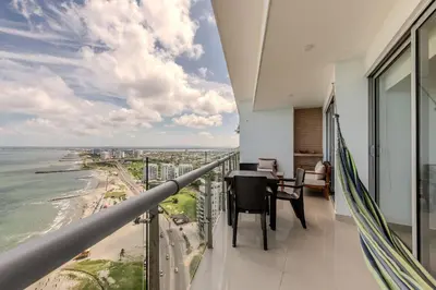 a balcony with a view of the ocean at Piso 24 vista al mar 2BR in Cartagena de Indias