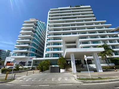 a large white building next to two tall buildings at Apartamento con Salida al Mar en Condominio Turístico y Hotel Sonnesta Cartagena, in Cartagena de Indias