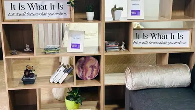 a book shelf with pamphlets and books on it at A 5 mins de CC único King, Aire, Wi-Fi, Cocina in La Mina