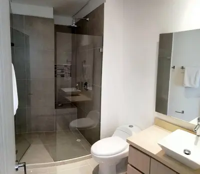 a bathroom with a shower and a toilet and a sink at Luxury Apartment - Stunning Sea View in Cartagena de Indias