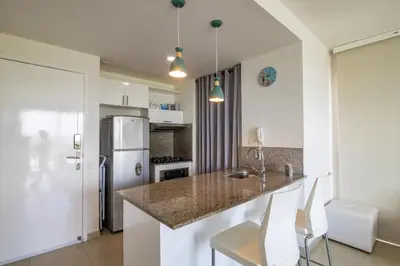 a kitchen with a counter and a refrigerator at Apto en Morros Epic Cartagena in Cartagena de Indias