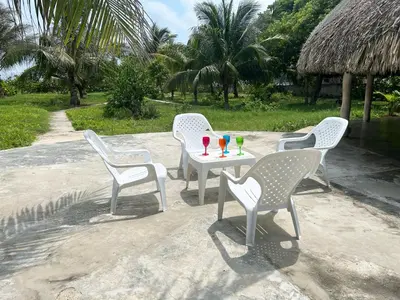 three chairs and a table with drinks on it at La Felicidá in Cartagena de Indias