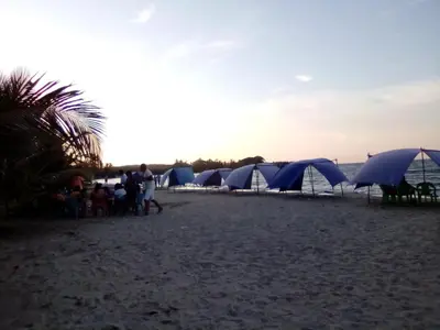 a group of blue tents on a beach at Condominio de Cabañas Cangrejo Azul in El Bobo