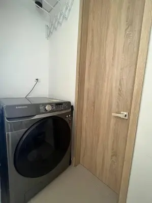 a door to a kitchen with a microwave next to it at CasaMaha Cartagena Espectacular Apartamento in Cartagena de Indias