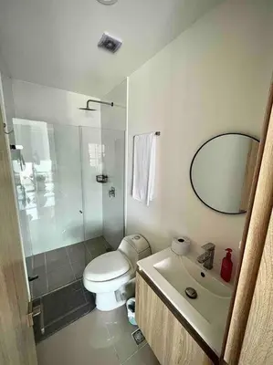 a bathroom with a toilet and a shower and a sink at CasaMaha Cartagena Espectacular Apartamento in Cartagena de Indias