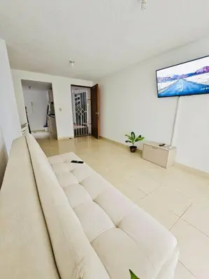 a living room with a couch and a flat screen tv at Apartamento Villa San Pedro in San Roque