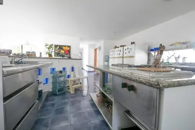 a kitchen with stainless steel appliances and a counter at Cabana Mangle Playa Privada in San Antero