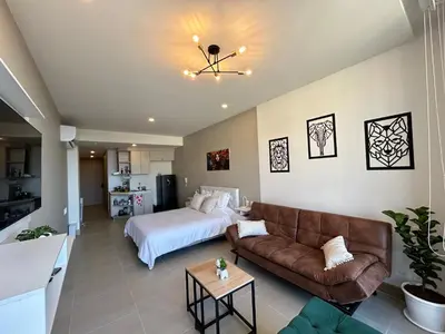 a living room with a bed and a couch at Lujo y relax frente al mar en Morros Eos in Cartagena de Indias