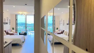 a hospital room with two beds and a mirror at Lujo y relax frente al mar en Morros Eos in Cartagena de Indias