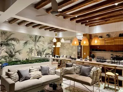 a living room with two couches and a bar at Santa Isabel - Villa de diseño con vistas privilegiadas y piscina in Cartagena de Indias