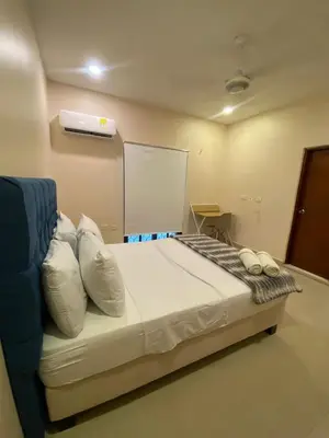 a bedroom with a large bed with white pillows at Casa Hotel La Niña Neyla in Cartagena de Indias