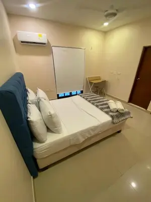 a bedroom with a large bed with pillows at Casa Hotel La Niña Neyla in Cartagena de Indias