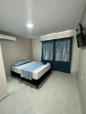 a bedroom with a bed and a television in it at Hotel Stay Golden in Cartagena de Indias