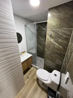 a bathroom with a toilet and a shower at Portofino Bocagrande 3 habitaciónes in Cartagena de Indias