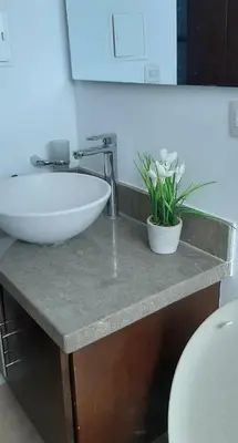 a bathroom with a white sink and a toilet at Edificio Mares de Coveñas in Coveñas