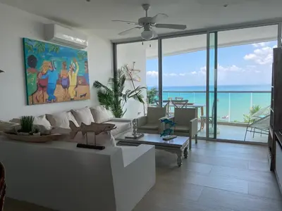 a living room with a view of the ocean at Edificio Mares de Coveñas in Coveñas